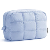 Narwey quilted makeup bag blue, front view, compact travel companion for cosmetics.