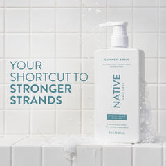 Native Cashmere Rain conditioner bottle on shelf for conditioning