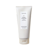 Naturium KP body scrub jar close-up shows exfoliating texture for smoother skin.