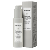 Naturium tranexamic topical acid 5% serum bottle closeup for even-tone skin.