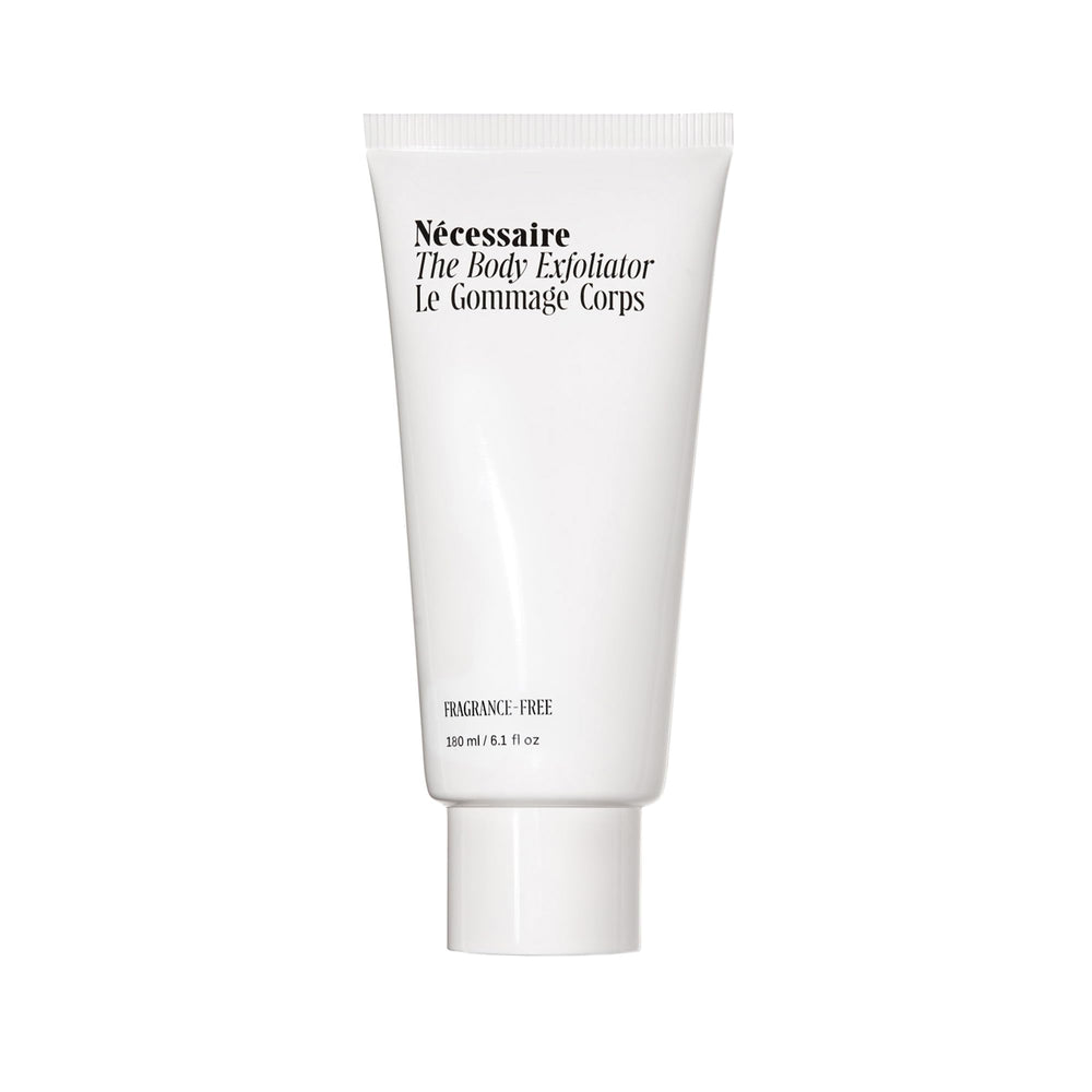 Nécessaire Body Exfoliator close-up shows volcanic pumice for gentle smoothing.