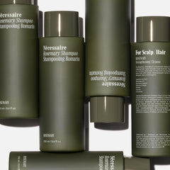 Nécessaire Rosemary Shampoo foam texture on palm indicating gentle daily cleanse.