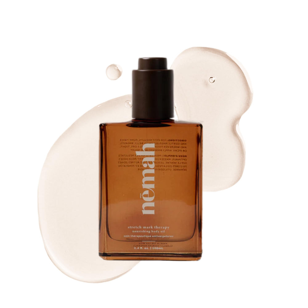 Nemah Belly Oil bottle pour for quick-dry hydration during pregnancy.