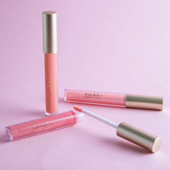 Nicole Miller brillo labial en estuche elegante para llevar en bolso.