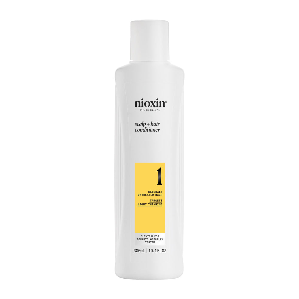 Nioxin System 1 conditioner bottle front showing lightweight moisture balance.