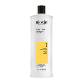 Nioxin System 1 shampoo bottle front view, cleansing thinning hair.