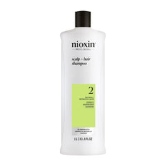Nioxin System 2 Shampoo bottle on shelf suggesting scalp cleansing for progressed thinning