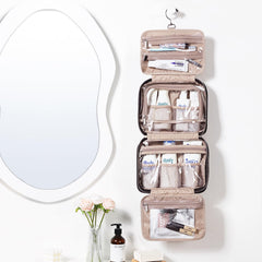 NISHEL bag opened to show four compartments for organized cosmetics.