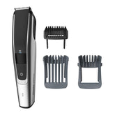 Norelco 5500 beard trimmer in hand for precise grooming