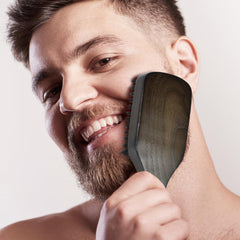 Norsewood Boar Bristle Brush ergonomic handle in use for daily grooming.
