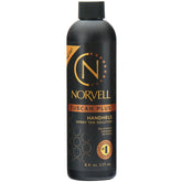 Norvell Tuscan Plus spray tan solution bottle showing professional, even color potential.