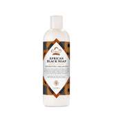 La crema Nubian Heritage en botella, hidratación duradera para piel seca.