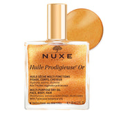 Nuxe Huile Prodigieuse Shimmer on the face for radiant glow and hydration.