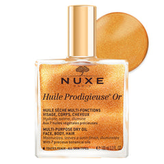 Nuxe Huile Prodigieuse Shimmer on the face for radiant glow and hydration.