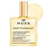 Nuxe Prodigieuse dry oil bottle close-up for radiant, lightweight hydration.