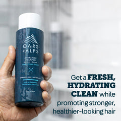 Oars + Alps conditioner silky gloss application for smooth, nourished hair.