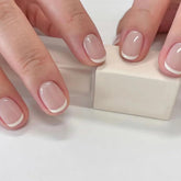 OCOUYVD Petite press-on nails with extra-short French tips for quick, salon-style results.