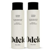 Odele Clarifying Shampoo bottle demonstrates a deep-clean action removing buildup