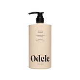 Odele Volumizing Shampoo bottle pour delivers lightweight moisture and radiant shine.