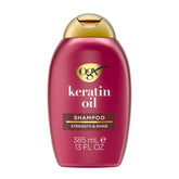OGX Champú Antiequiebre con Keratina y Aceite en botella, limpieza suave y fortalecedora.
