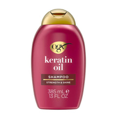 OGX Champú Antiequiebre con Keratina y Aceite en botella, limpieza suave y fortalecedora.