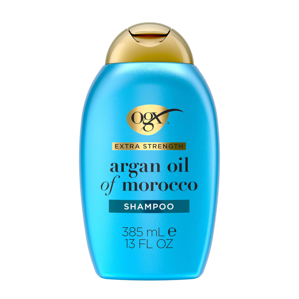 OGX champú hidratante y reparador en botella para cabello seco.