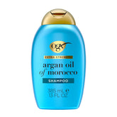 OGX champú hidratante y reparador en botella para cabello seco.
