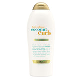 OGX Quenching + Coconut Curls vertido de la botella para una aplicación suave.