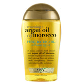 OGX Renewing + Argan Oil: botella vertiendo aceite para brillo inmediato