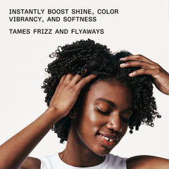 Olaplex No. 7 Bonding Oil on glossy hair showcases frizz control and smoothness.