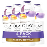 Olay Age Defying Body Wash bottle pouring with creamy lather for daily hydration.