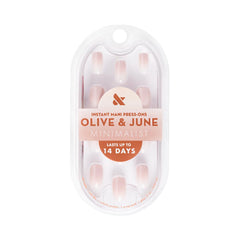 Close-up of Olive and June Instant Mani glue application process for secure wear.