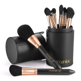 OMANIAC makeup brush set with pearlescent wood handles for precise application.