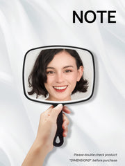 OMIRO mirror demonstrating two-way design for handheld use or hanging