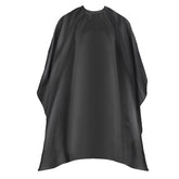 Omvoina cape with adjustable snaps for a comfortable, secure fit during haircuts.