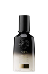 Oribe Balm D'Or Heat Shield bottle shown for heat styling protection and shine.