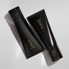 Oribe Crème for Style dispenser demonstrates easy application for frizz control.