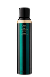 Oribe Curl Shaping Mousse bottle shows strong hold and shine.