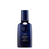 Oribe Feather Balm Ultra Light Bottle showcases weightless shine for fine hair.