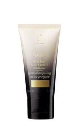 Oribe Gold Lust Repair & Restore conditioner bottle delivers luxe hydration for aged hair.