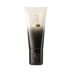 Oribe Gold Lust Repair & Restore Conditioner bottle promotes revived, glossy hair.