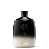 Oribe Gold Lust Shampoo bottle pour, highlighting cleansing and scalp balance for hair care