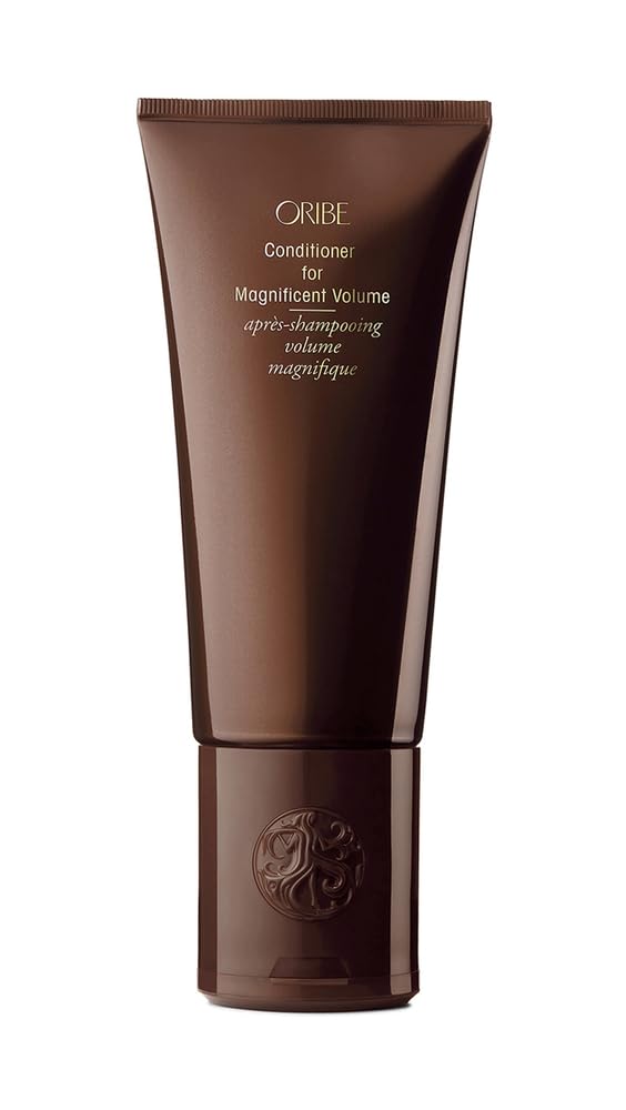 Oribe Magnificent Volume bottle pour showing feather-light conditioning for detangling