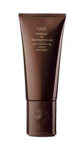 Oribe Magnificent Volume bottle pour showing feather-light conditioning for detangling