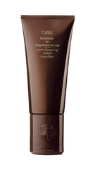 Oribe Magnificent Volume bottle pour showing feather-light conditioning for detangling