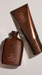 Oribe Magnificent Volume model with voluminous shiny hair after use