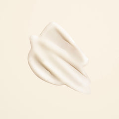Closeup cap of Oribe Matte Waves Texture Lotion with pull-off design