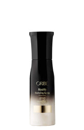 Oribe Mystify Restyling Spray: botella, reactivando estilo con hidratación ligera y protección.
