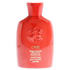 ORIBE champú rubio brillante: botella vertiendo para realzar el tono violeta.