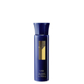 Oribe Run-Through Detangler bottle offers a lightweight conditioning mist for silky, knot-free hair.